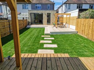 full landscape garden with patio area and pergola, summerhouse and decking with Fencing